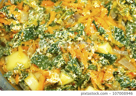 Nettle soup with carrots, close up. 107008946
