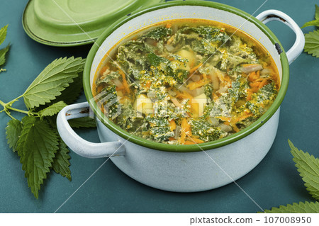 Seasonal fresh nettle soup. 107008950