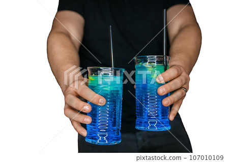 Bartender's hands serve 2 alcoholic cocktails with blue syrup blue lagoon in the white isolated background 107010109