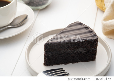 Delicious Sliced of Classic Chocolate Cake on white plate Delicious Sliced of Classic Chocolate Cake on white plate 107010166