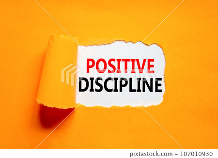 Positive discipline symbol. Concept words Positive discipline on beautiful white paper. Beautiful orange paper background. Business psychology positive discipline concept. Copy space. 107010930