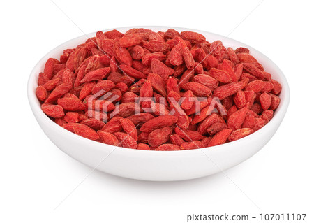 Dried goji berries in ceramic bowl isolated on white background with full depth of field Dried goji berries in ceramic bowl isolated on white background with full depth of field 107011107