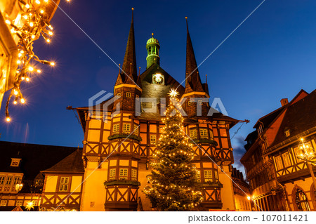 Market square historic city hall Wernigerode in Harz region of Sachsen-Anhalt Land Germany evening night sky. Christmas decoration in old European small scenic town. Scenic Europe travel destination 107011421