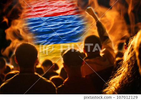 Protest Armenia. Conflict war between Armenia and Azerbaijan over Nagorno-Karabakh. Let's stop the war. Azerbaijan and Armenia conflict. Country flags on flame background. Out of focus 107012129