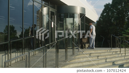 Male nurse meets female patient with disability 107012424