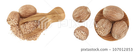 Whole and grated nutmeg in wooden scoop isolated on white background with full depth of field. Top view. Flat lay 107012853