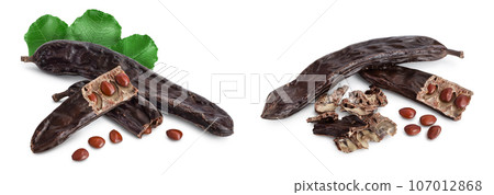 Ripe carob pods and bean isolated on white background with full depth of field Ripe carob pods and bean isolated on white background with full depth of field 107012868