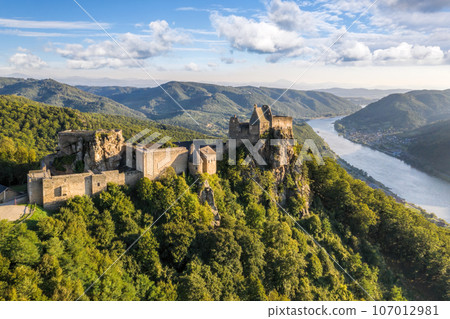 Panorama with Aggstein castle ruin and Danube river at sunset in Wachau walley(Unesco world heritage site), Lower Austria, Austria Panorama with Aggstein castle ruin and Danube river at sunset in Wachau walley(Unesco world heritage site), Lower Austria, Austria 107012981