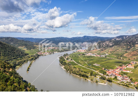 Panorama of Wachau valley (Unesco world heritage site) with ship on Danube river against Duernstein village in Lower Austria, Austria Panorama of Wachau valley (Unesco world heritage site) with ship on Danube river against Duernstein village in Lower Austria, Austria 107012982