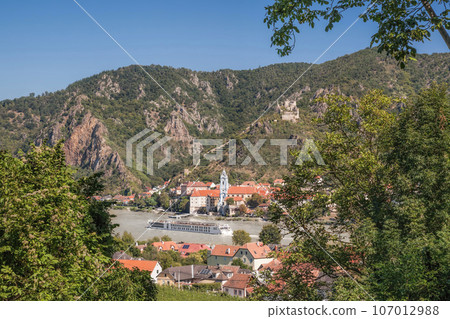 Panorama of Wachau valley (Unesco world heritage site) with ship on Danube river against Duernstein village in Lower Austria, Austria Panorama of Wachau valley (Unesco world heritage site) with ship on Danube river against Duernstein village in Lower Austria, Austria 107012988