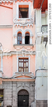 Street view of the facade of an old colonial building, Quito, Ecuador. Street view of the facade of an old colonial building, Quito, Ecuador. 107013160