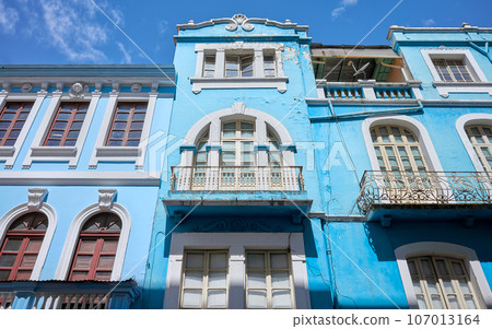 Street view of the facade of an old colonial building, Quito, Ecuador. Street view of the facade of an old colonial building, Quito, Ecuador. 107013164