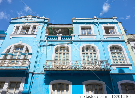 Street view of the facade of an old colonial building, Quito, Ecuador. Street view of the facade of an old colonial building, Quito, Ecuador. 107013165