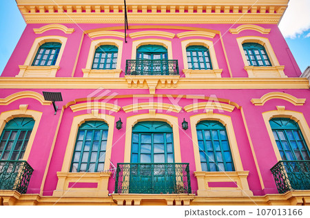 Street view of the facade of an old colonial building, Quito, Ecuador. 107013166