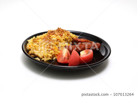 Biryani on a black plate with white background Biryani on a black plate with white background 107013264