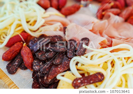 A tray with cheese and meat appetizers on the banquet table. A tray with cheese and meat appetizers on the banquet table. 107013641