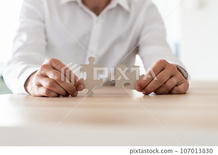 Businessman or career consultant at his desk Businessman or career consultant at his desk 107013830