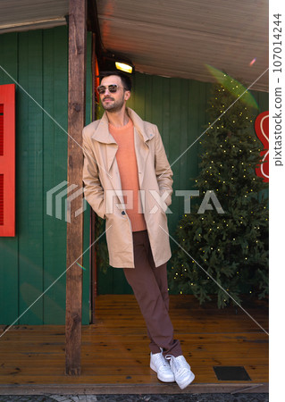 Man wearing sunglasses posing outdoors Man wearing sunglasses posing outdoors 107014244