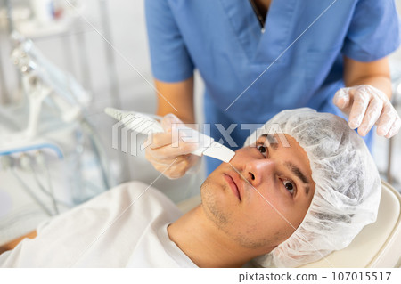 doctor deftly wields Skin Scrubbe doctor deftly wields Skin Scrubbe 107015517