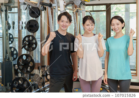 Instructor doing fist pump at personal gym Instructor doing fist pump at personal gym 107015826