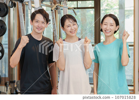 Instructor doing fist pump at personal gym Instructor doing fist pump at personal gym 107015828