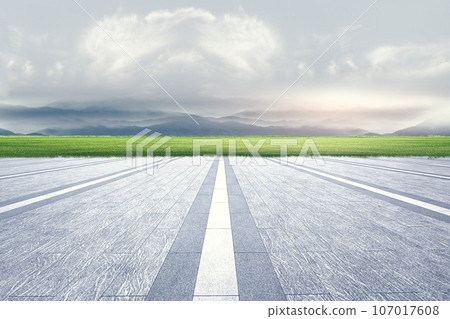 Unmanned brick square platform and grassland with mountains natural landscape background 107017608