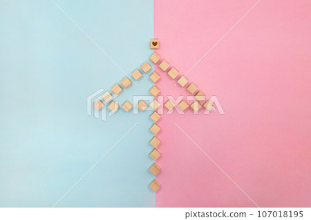 Background of triangular umbrella wood cube frame divided into pale blue and pink 107018195