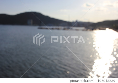 September 9, 2023: Jinhaeru in Jinhae, Jinhae-gu, Changwon-si, Gyeongsangnam-do, South Korea, beach sunset bokeh 107018889