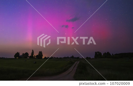 Northern lights - Aurora borealis dancing in the night sky. 107020009