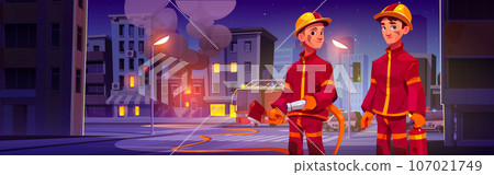Two firefighters in front of fire in city 107021749