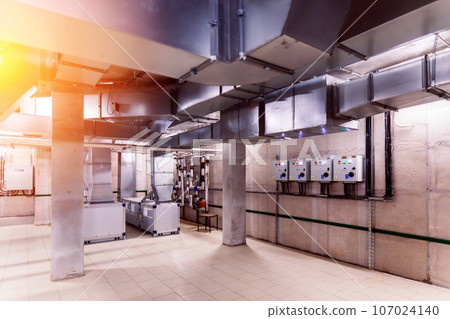 Interior industrial gas boiler with a lot of piping, pumps and valves 107024140