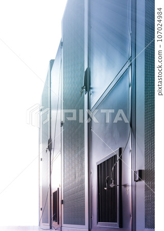 Data center with a row of server racks 107024984