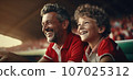 Young boy and his dad laugh at the football game. AI-generated content. 107025312