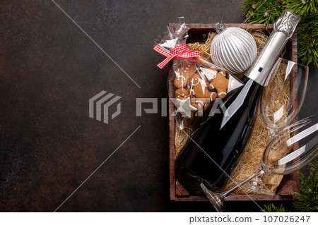 Box with Christmas gingerbread cookies and champagne Box with Christmas gingerbread cookies and champagne 107026247