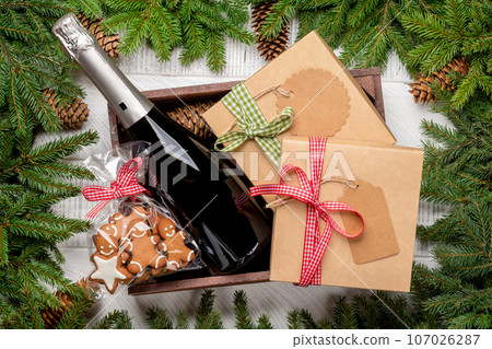 Box with Christmas gingerbread cookies and champagne Box with Christmas gingerbread cookies and champagne 107026287