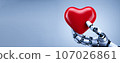 Close-up of a robot's hand holding a heart. Robot mind, AI control, generated AI images 107026861