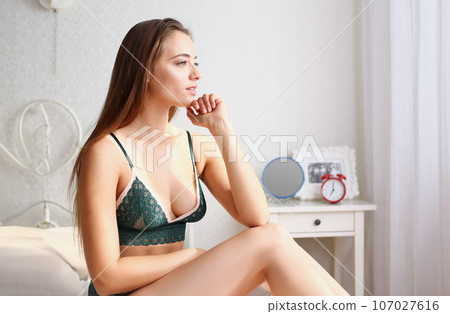 Young beautiful blonde smiling woman portrait 107027616