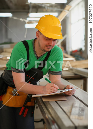 Portrait of young attractive man in work Portrait of young attractive man in work 107027620