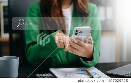 Searching Browsing Internet Data Information Networking Concept with blank search bar.man working with mobile phone and laptop computer VR icon . 107029438