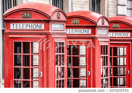 Famous red telephone booths in Covent Garden street, London, England, United Kingdom Famous red telephone booths in Covent Garden street, London, England, United Kingdom 107029701