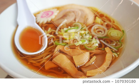 Ramen soup scooped with lotus flower Ramen soup scooped with lotus flower 107030180