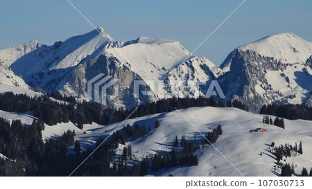 Snow covered mountain ranges near Zweisimmen. Snow covered mountain ranges near Zweisimmen. 107030713