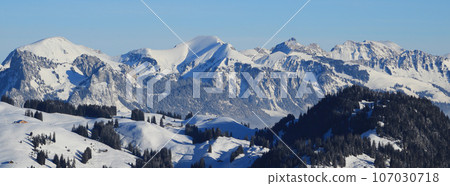 Snow covered mountains Schafberg and Kaiseregg. Winter landscape near Zweisimmen, Swiss Alps.. Snow covered mountains Schafberg and Kaiseregg. Winter landscape near Zweisimmen, Swiss Alps.. 107030718