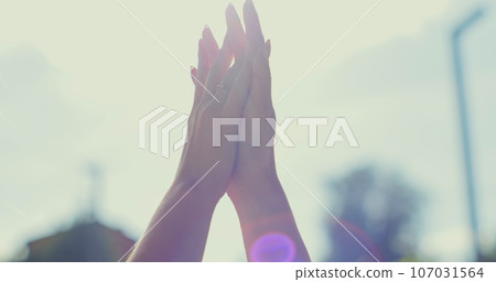 Two women sharing love and support holding hands at sanset background. Lifestyle and relationships. LGBT concept. 107031564