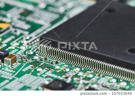 Close-up of computer chip on a part of electronic printed circuit board Close-up of computer chip on a part of electronic printed circuit board 107033649