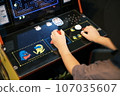 person playing games at a game center 107035607