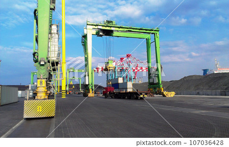 Container terminal. Sea port container terminal during work at night in fog 107036428