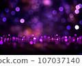 Creative background with blurred purple bokeh on black background 107037140