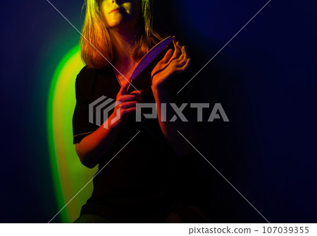 Influencer blogger in uniform is engaged in customer communications in a modern office. Influencer blogger in uniform is engaged in customer communications in a modern office. 107039355