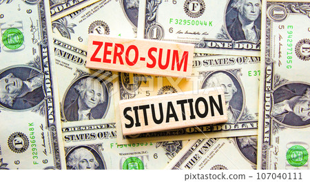 Zero-sum situation symbol. Concept words Zero-sum situation on beautiful wooden blocks. Dollar bills. Beautiful background from dollar bills. Business psychology zero-sum situation concept. Copy space 107040111